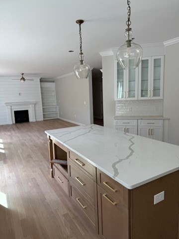 Lot 7 Muriel Way Rehoboth, MA 02769 - Photo 8 of 28 a kitchen with a stove and a fireplace