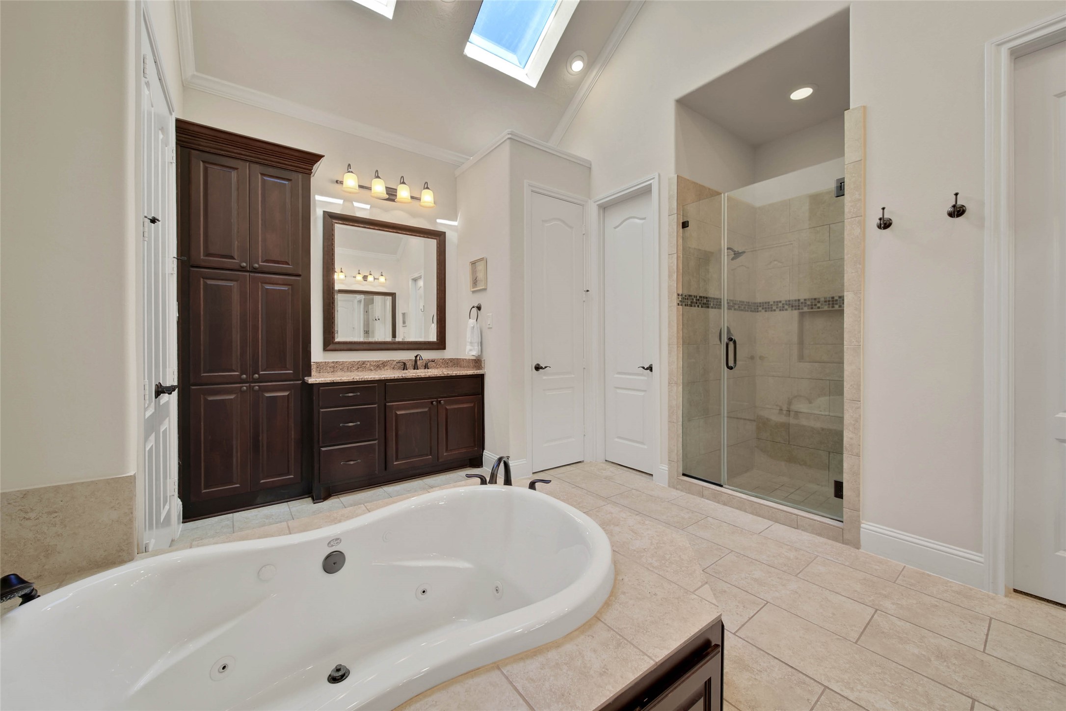 3234 Explorer Way Conroe, TX 77301 - Photo 28 of 44 a bathroom with a tub sink and mirror