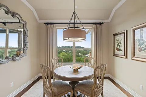 a view of a dining room with furniture window and outside view
