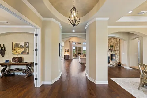 a view of a livingroom kitchen and dining room with wooden floor