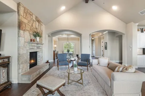 a living room with furniture fireplace and a fireplace