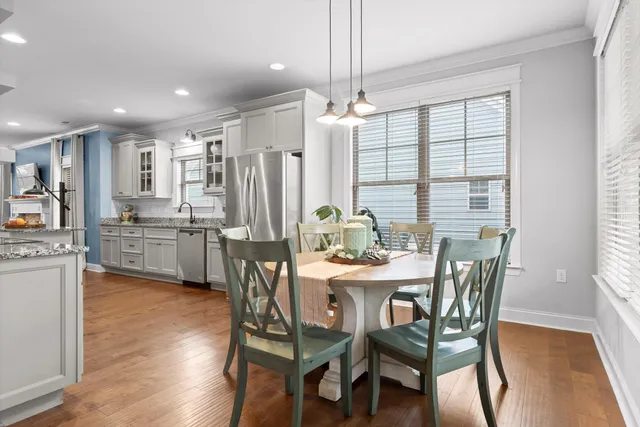 a view of a dining room with furniture window and wooden floor