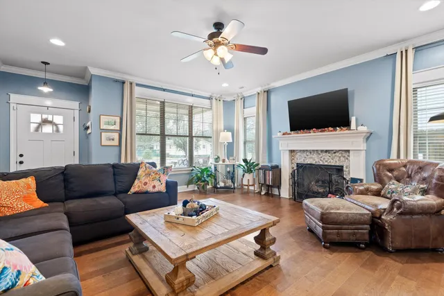 a living room with furniture fireplace and flat screen tv