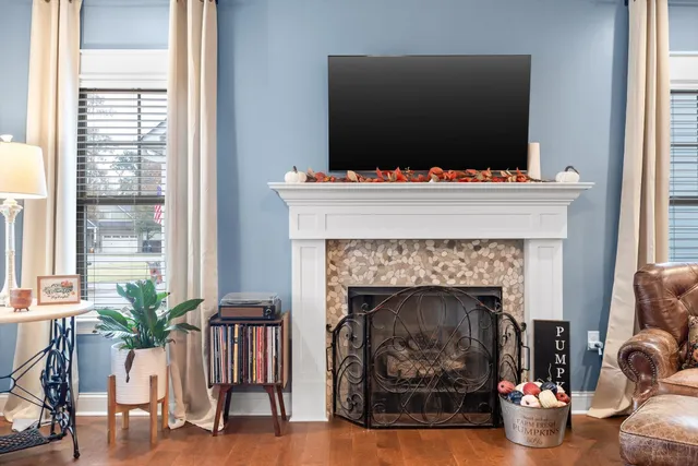 a living room with furniture and a fireplace