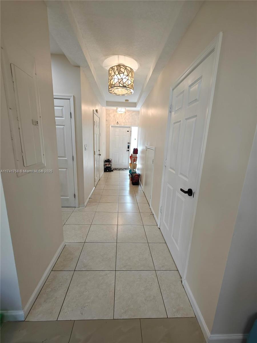 2583 Riverside Drive, Unit 2583 Coral Springs, FL 33065 - Photo 7 of 33 a view of a hallway with a furniture