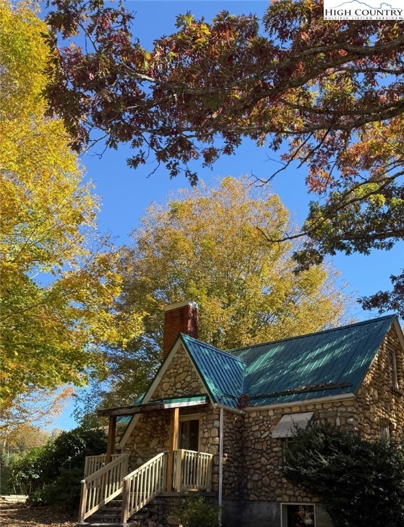 a view of a wooden deck and a mountain