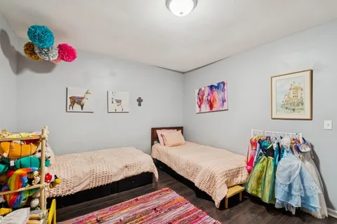 a bedroom with a bed and a couch