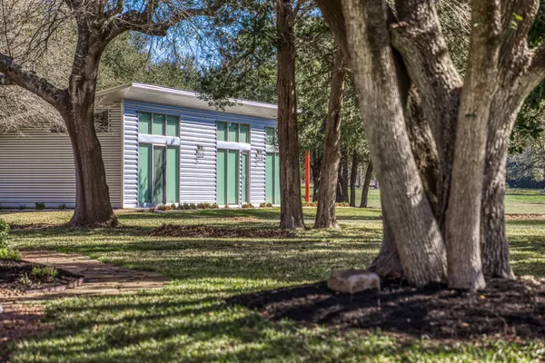 a house with trees in front of it