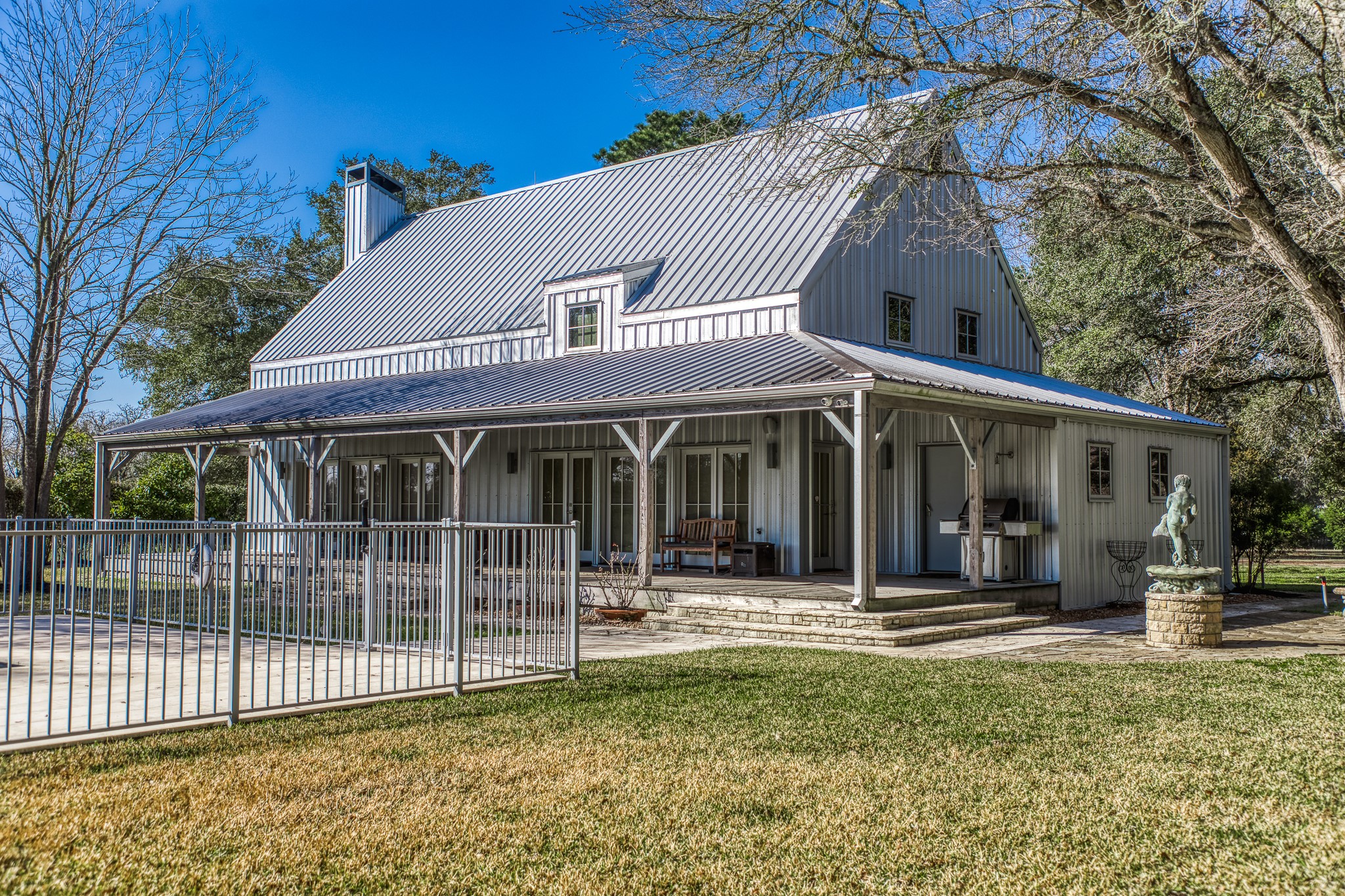 1585 Round Top Road Round Top, TX 78954 - Photo 2 of 30 a front view of a house with a porch