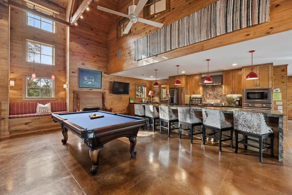 a view of a patio with a table and chairs