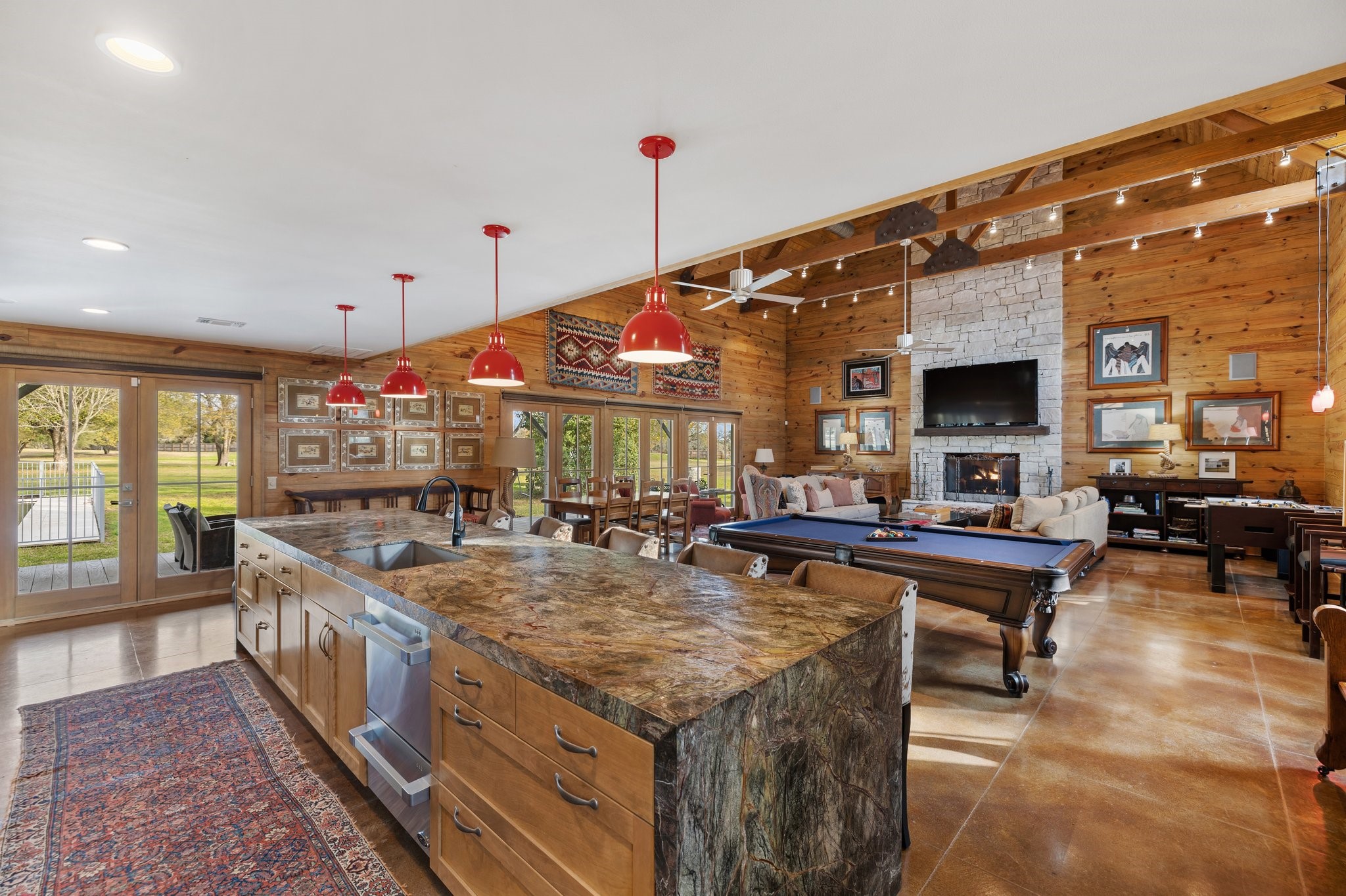1585 Round Top Road Round Top, TX 78954 - Photo 5 of 30 a view of a kitchen with kitchen island stainless steel appliances a stove and a large window