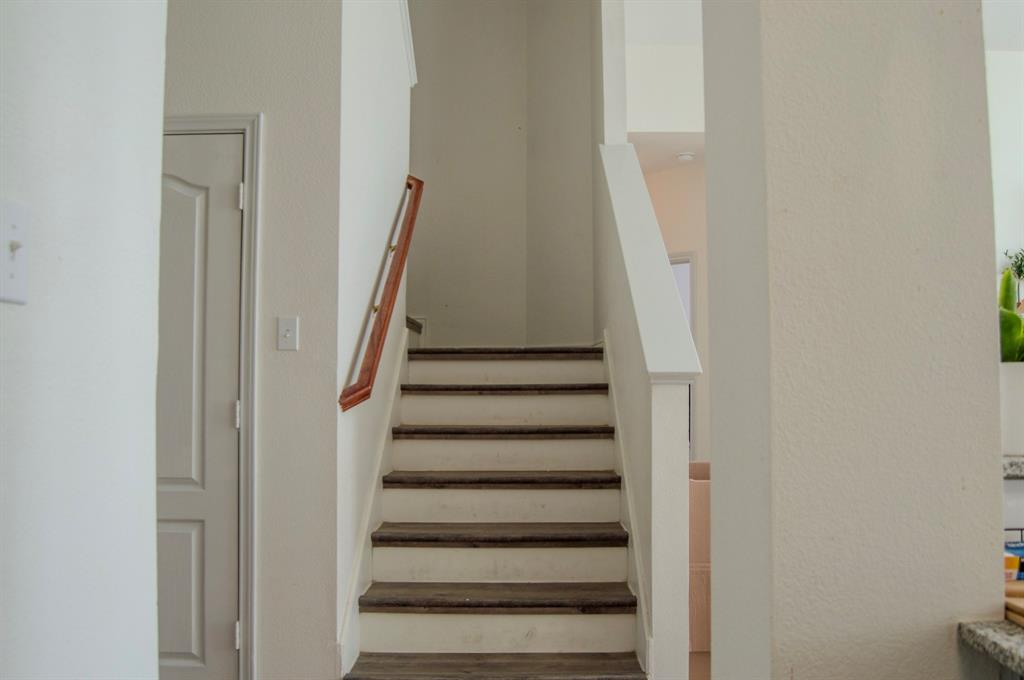 2700 Hereford Road Denton, TX 76210 - Photo 12 of 38 Staircase featuring wood finished floors