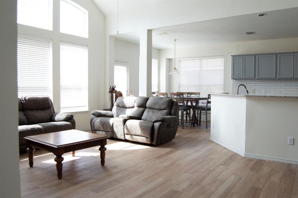 2700 Hereford Road Denton, TX 76210 - Photo 18 of 38 Living room featuring light wood finished floors and lofted ceiling
