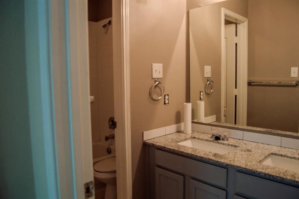 2700 Hereford Road Denton, TX 76210 - Photo 19 of 38 Bathroom featuring double vanity and shower / bathtub combination