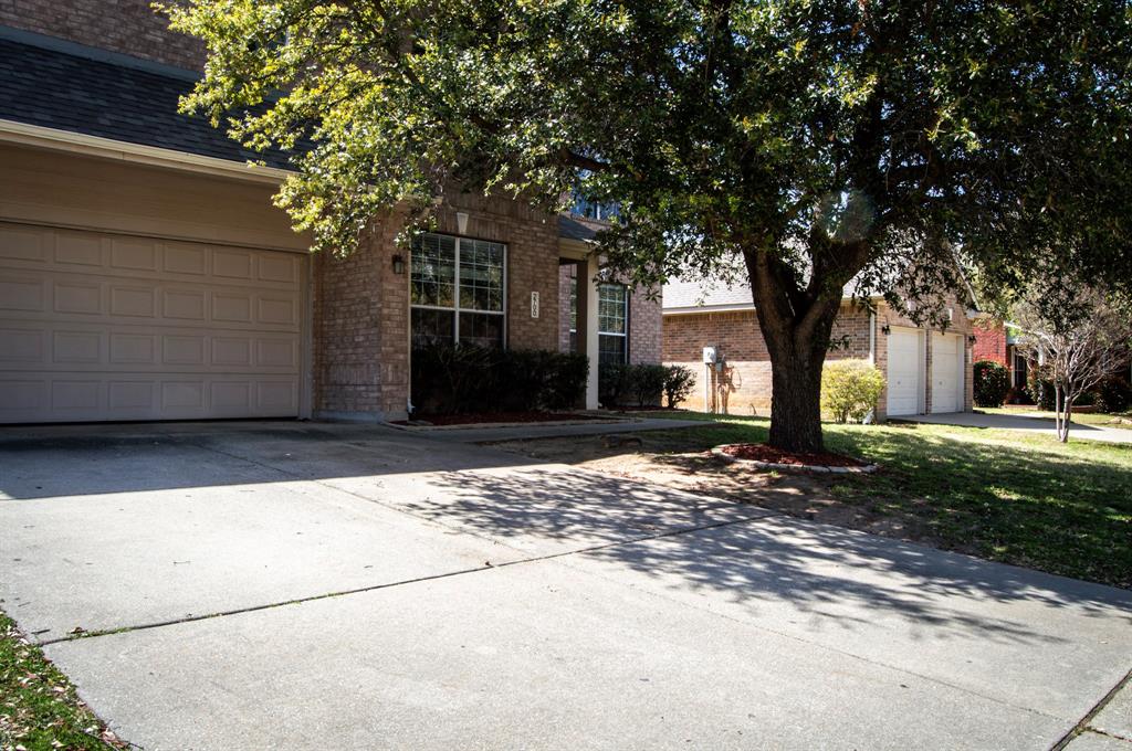 2700 Hereford Road Denton, TX 76210 - Photo 2 of 38 Obstructed view of property featuring driveway and brick siding