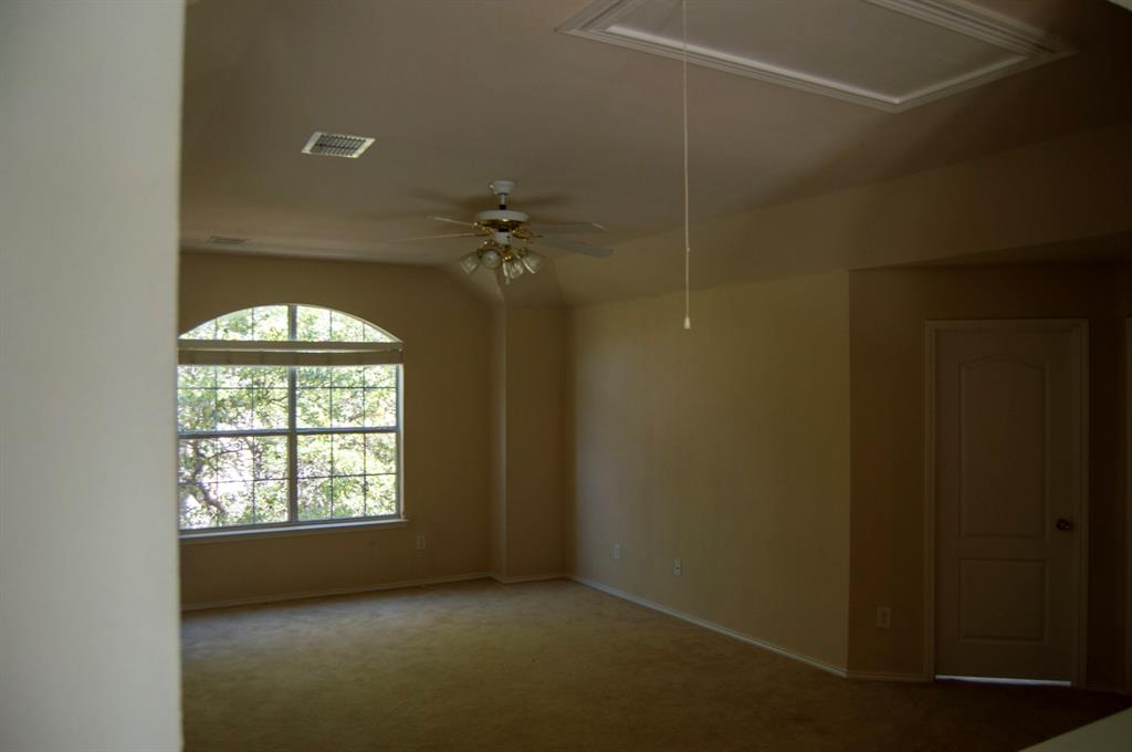 2700 Hereford Road Denton, TX 76210 - Photo 21 of 38 Empty room with carpet flooring, vaulted ceiling, and ceiling fan