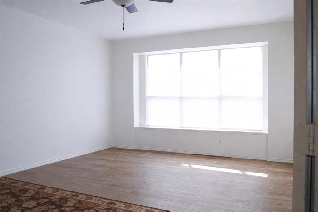 2700 Hereford Road Denton, TX 76210 - Photo 25 of 38 Unfurnished room featuring wood finished floors and ceiling fan
