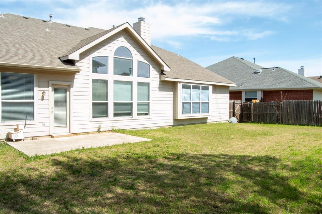 2700 Hereford Road Denton, TX 76210 - Photo 38 of 38 Back of property featuring roof with shingles, a patio, and a chimney