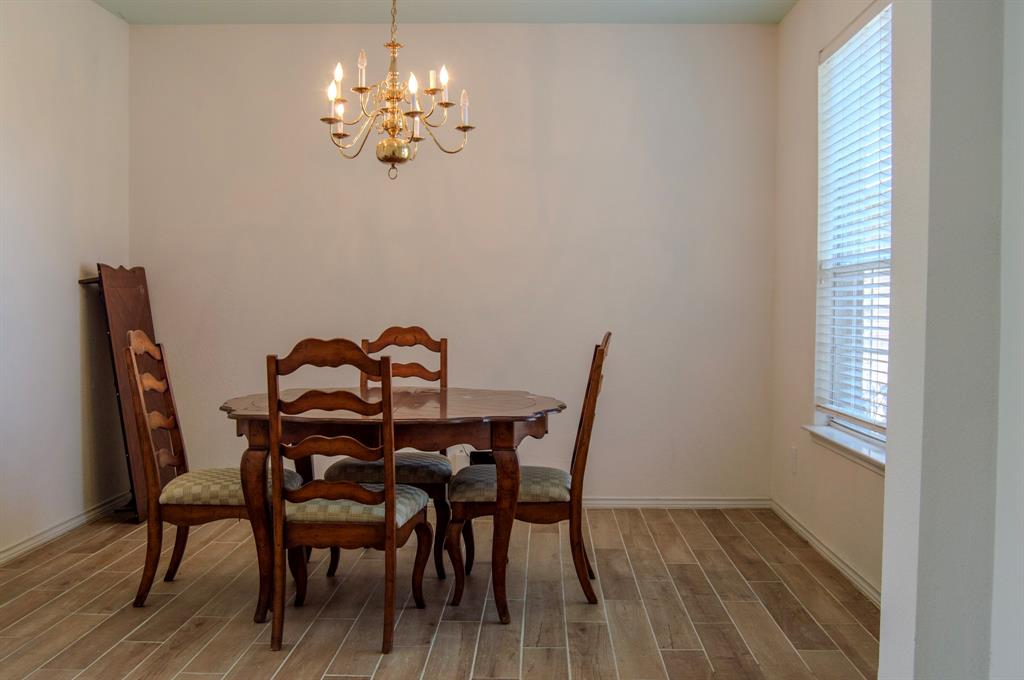 2700 Hereford Road Denton, TX 76210 - Photo 5 of 38 Dining space with wood finish floors, hanging lights, and healthy amount of natural light