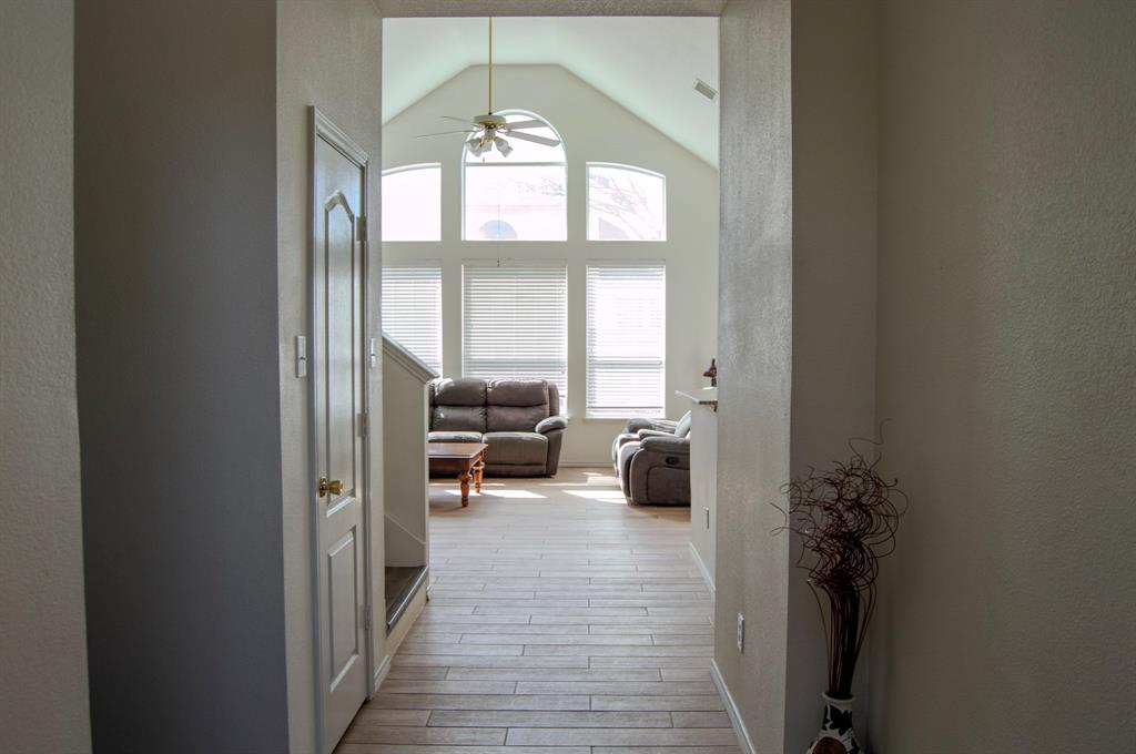 2700 Hereford Road Denton, TX 76210 - Photo 8 of 38 Hall with light wood-style flooring and a high ceiling