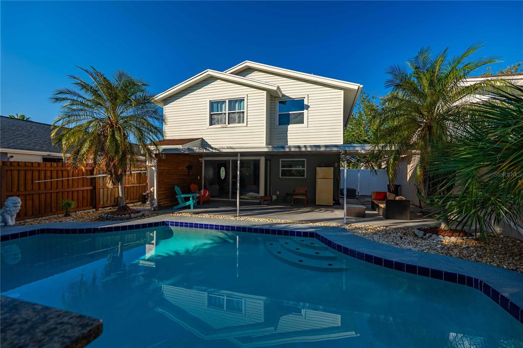 5124 Springwood Drive Tampa, FL 33624 - Photo 13 of 53 a front view of a house with garden