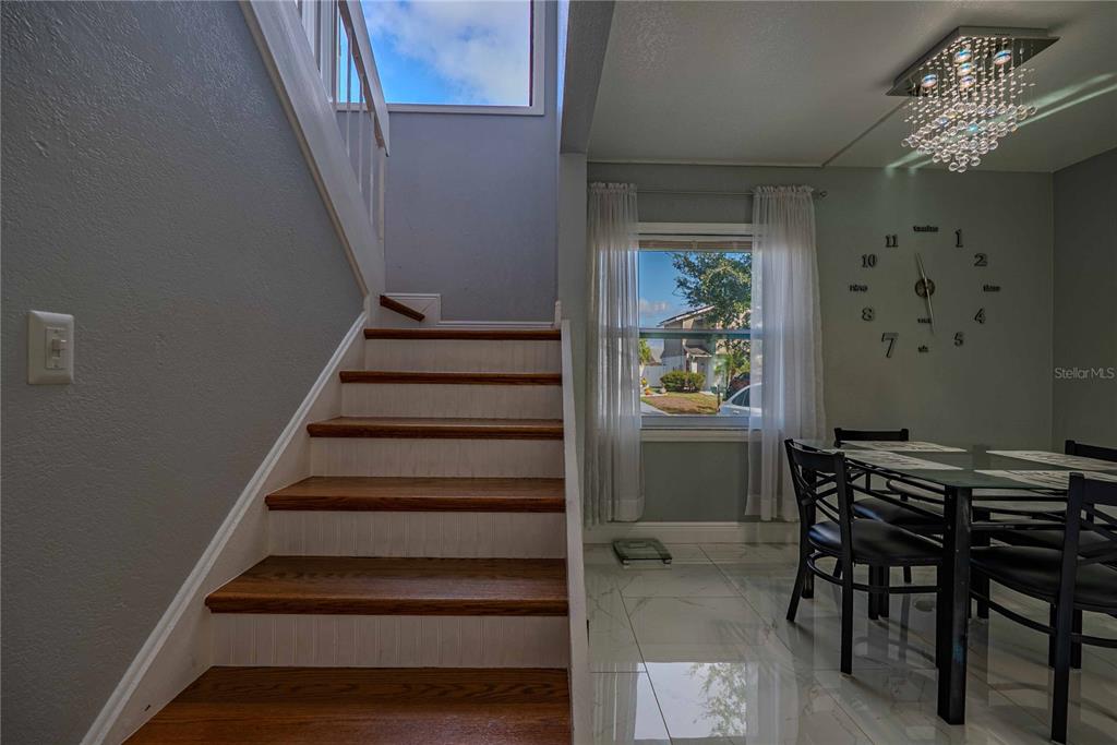 5124 Springwood Drive Tampa, FL 33624 - Photo 22 of 53 a view of entryway and hall with wooden floor