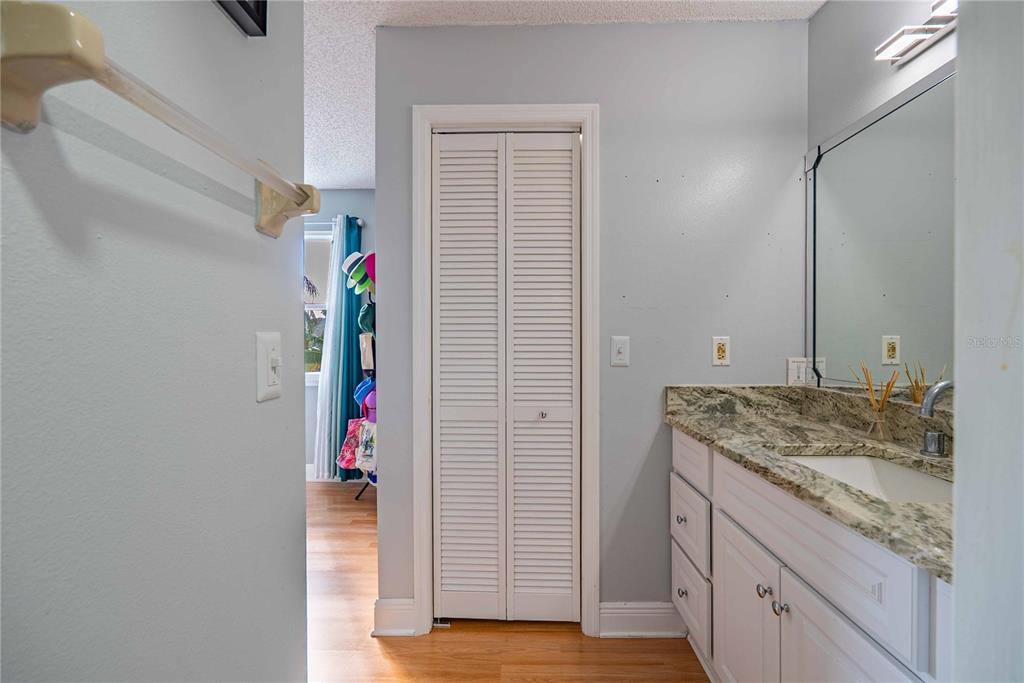 5124 Springwood Drive Tampa, FL 33624 - Photo 35 of 53 a bathroom with a granite countertop sink and a mirror