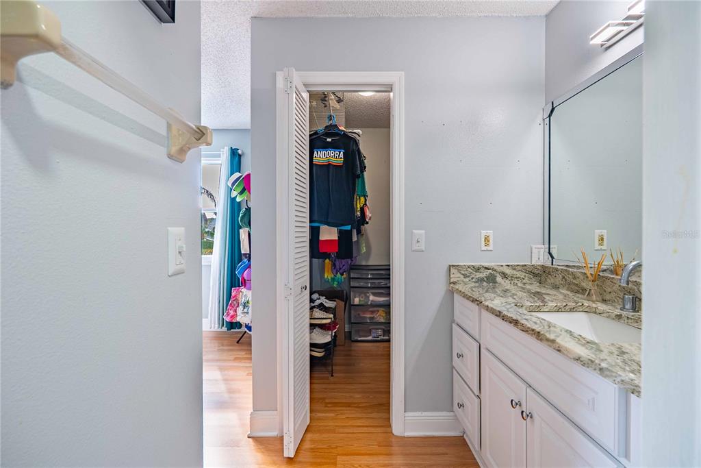 5124 Springwood Drive Tampa, FL 33624 - Photo 36 of 53 a hallway with a sink and cabinets