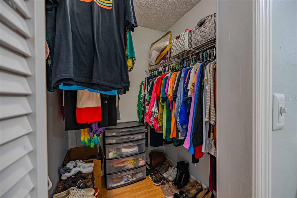 5124 Springwood Drive Tampa, FL 33624 - Photo 37 of 53 a view of walk in closet with clothes
