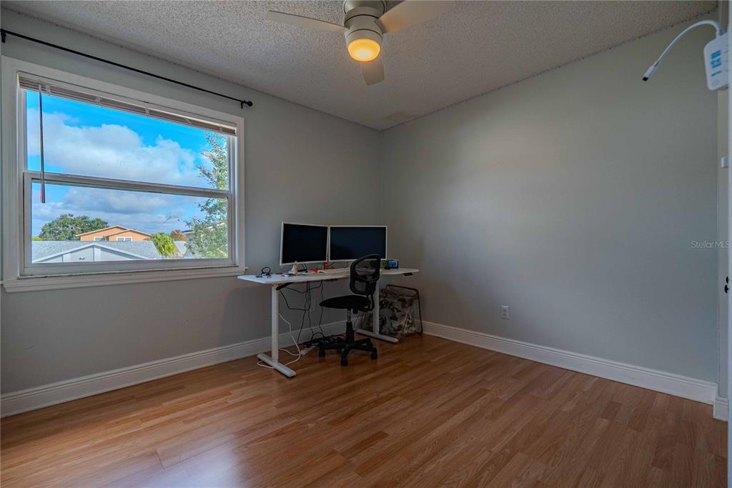5124 Springwood Drive Tampa, FL 33624 - Photo 40 of 53 a view of a workspace with furniture and a window