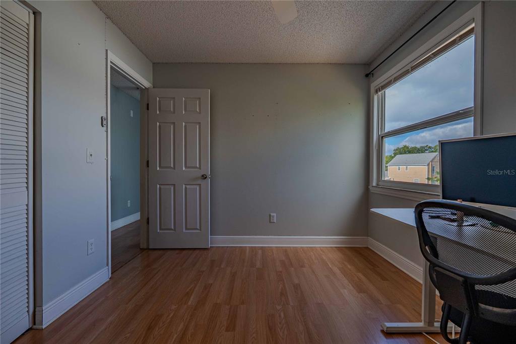 5124 Springwood Drive Tampa, FL 33624 - Photo 41 of 53 a view of a livingroom with wooden floor and furniture