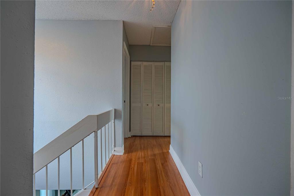 5124 Springwood Drive Tampa, FL 33624 - Photo 43 of 53 a view of a hallway with wooden floor
