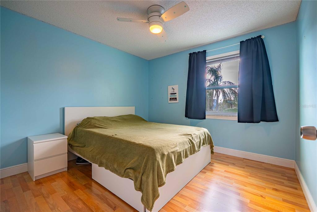 5124 Springwood Drive Tampa, FL 33624 - Photo 44 of 53 a bedroom with a bed and window