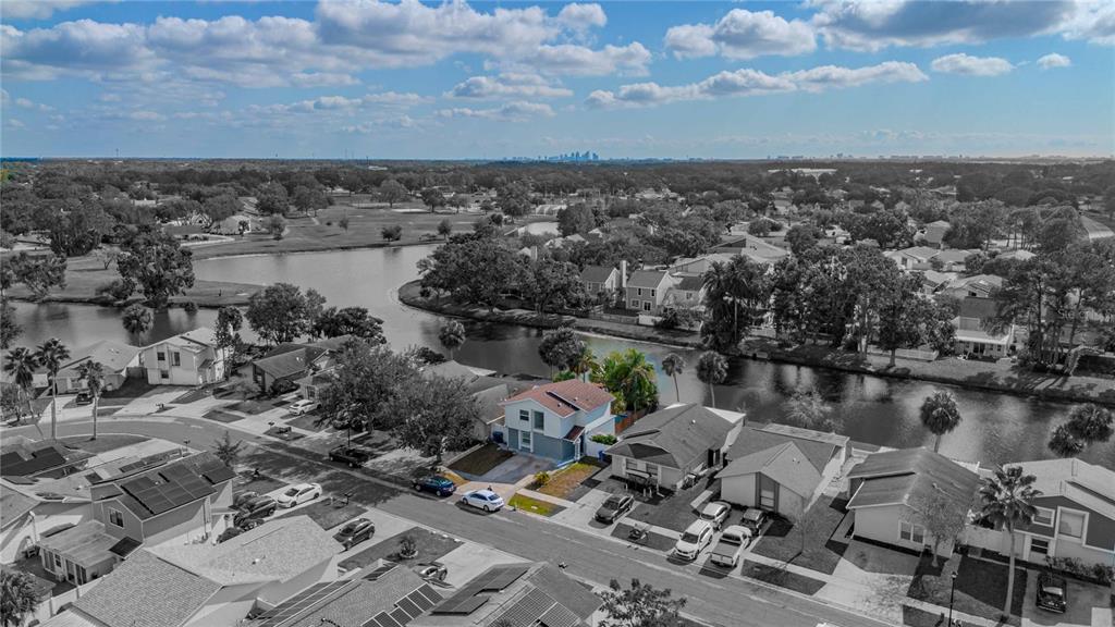 5124 Springwood Drive Tampa, FL 33624 - Photo 47 of 53 an aerial view of a house with a lake view