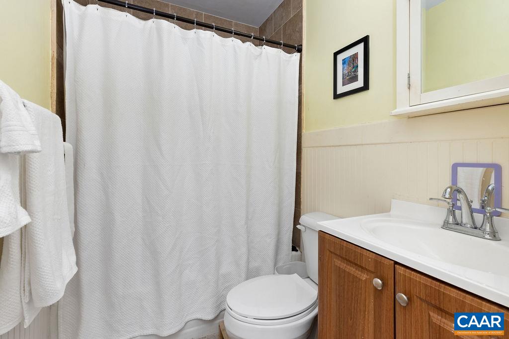 1002 2nd Street Southeast Charlottesville, VA 22902 - Photo 12 of 29 a bathroom with a sink a toilet and shower