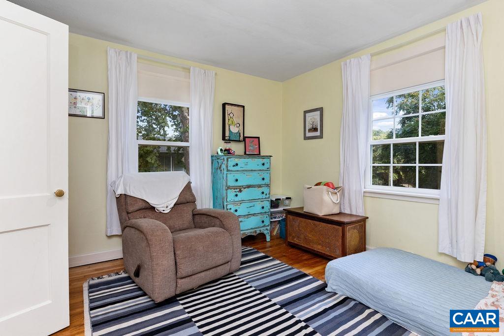 1002 2nd Street Southeast Charlottesville, VA 22902 - Photo 15 of 29 a living room with furniture and a window