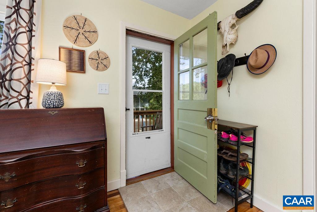 1002 2nd Street Southeast Charlottesville, VA 22902 - Photo 4 of 29 a room with a wooden floor a rug and a window