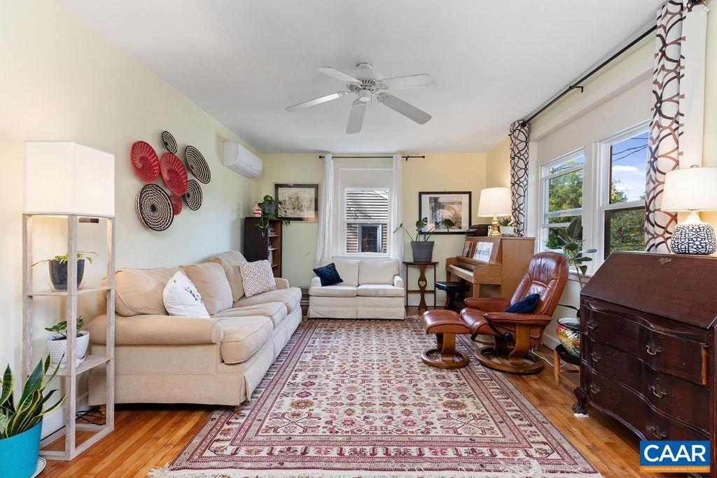 1002 2nd Street Southeast Charlottesville, VA 22902 - Photo 6 of 29 a living room with furniture and a chandelier