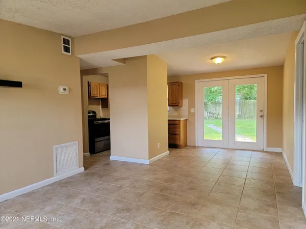 a view of an empty room with a window