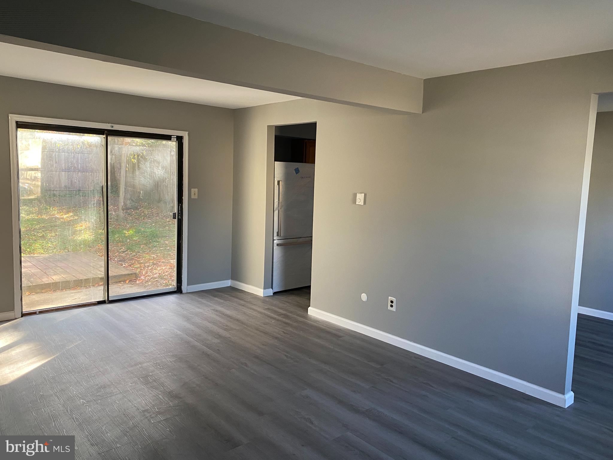 14 Berkshire Road Sicklerville, NJ 08081 - Photo 2 of 17 an empty room with wooden floor and windows