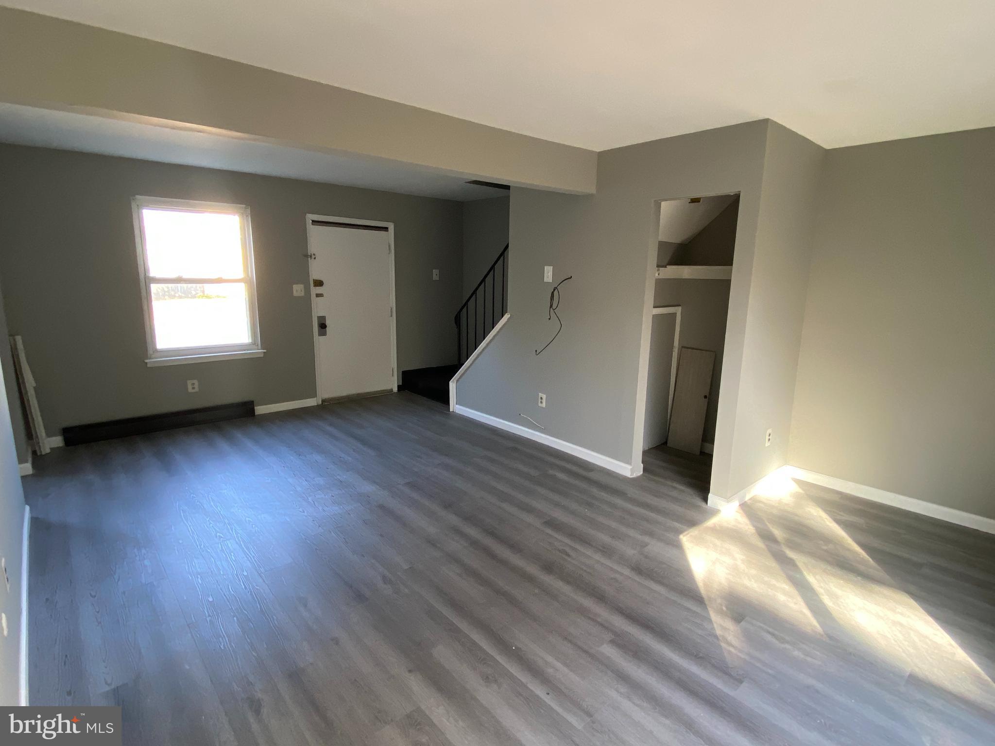 14 Berkshire Road Sicklerville, NJ 08081 - Photo 4 of 17 an empty room with wooden floor and windows