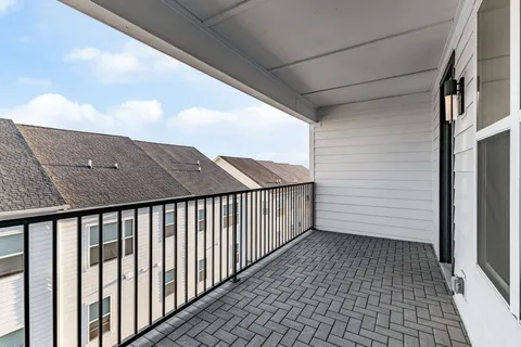 a balcony with a rug