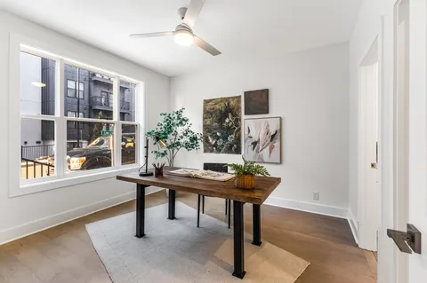 a view of a workspace with furniture