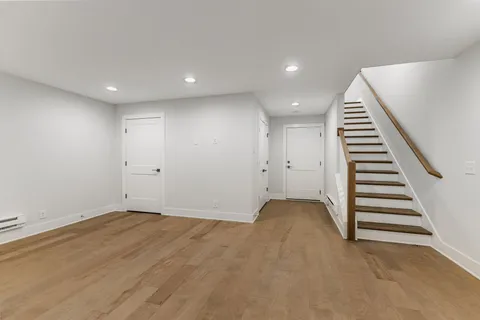 a view of an empty room with stairs