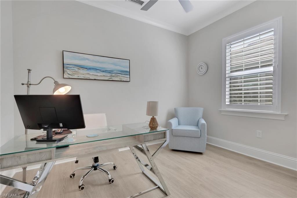 8861 Yucatan Court Naples, FL 34113 - Photo 20 of 39 a living room with furniture and a flat screen tv