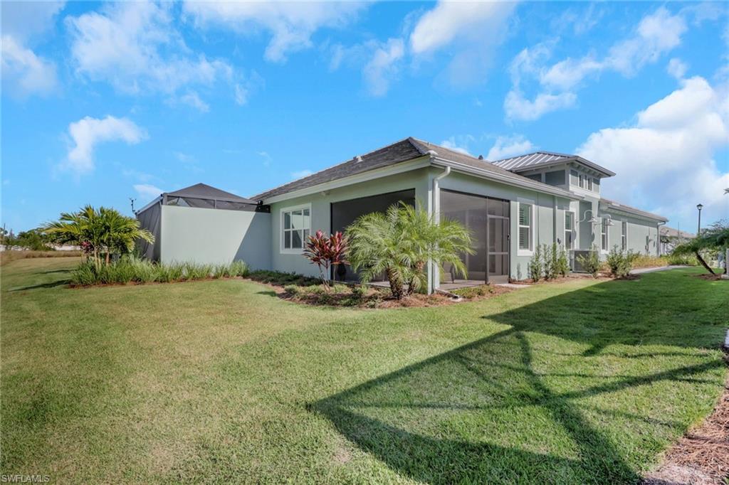 8861 Yucatan Court Naples, FL 34113 - Photo 22 of 39 a front view of a house with garden