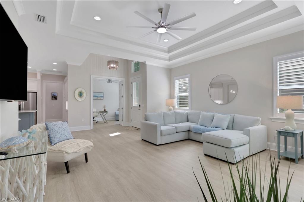 8861 Yucatan Court Naples, FL 34113 - Photo 5 of 39 a living room with furniture and a flat screen tv
