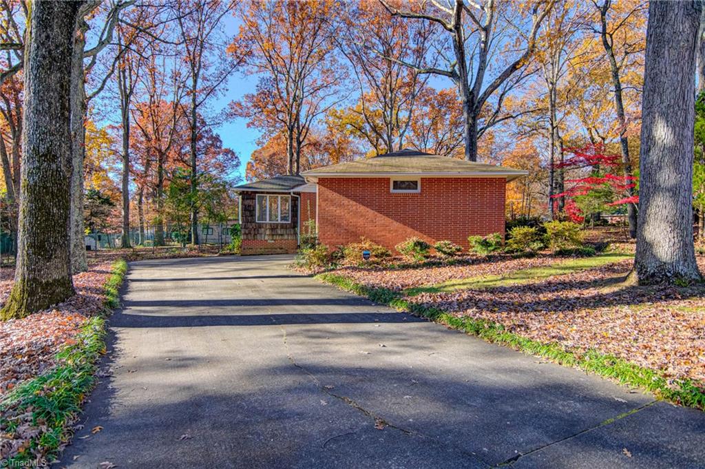 861 Chester Road Winston-Salem, NC 27104 - Photo 17 of 17 2 car garage and sunroom/dining room. There is a gate to the backyard here.