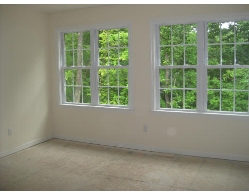 14 Reed Lane, Unit 14 Littleton, MA 01460 - Photo 8 of 12 an empty room with a window