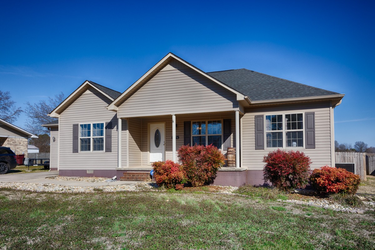 27474 North Wales Road Elkmont, AL 35620 - Photo 1 of 30 a front view of a house with garden